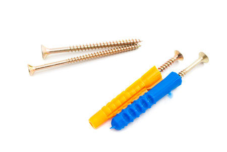 colored dowels and different screws on white