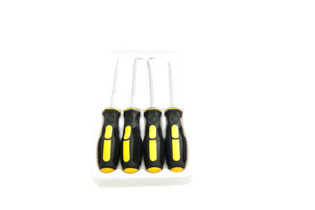 four awls with black handles closeup on white background
