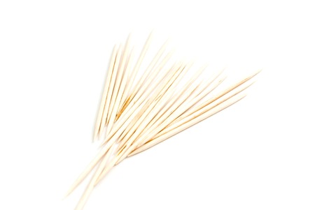 heap of wooden toothpicks on white backgroundの写真素材