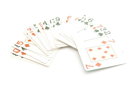 plastic playing cards deck on white background closeup