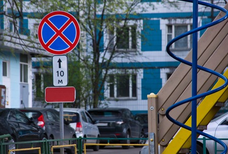 road sign on a street near playgroundの写真素材