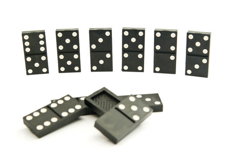 different dominoes chips on white background closeup