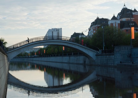 man on the stone bridge over the riverの写真素材