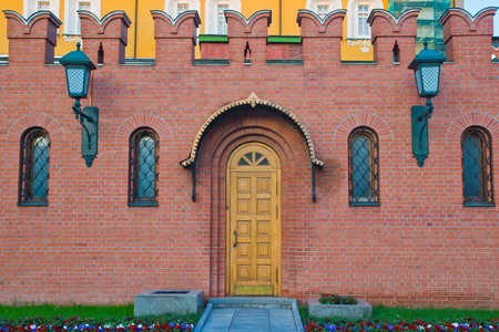 door in the brick wall of the Kremlinの写真素材
