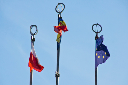 three different flags on background of blue skyの写真素材