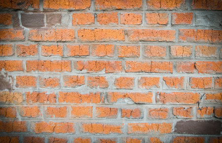 orange brick wall of building background closeup