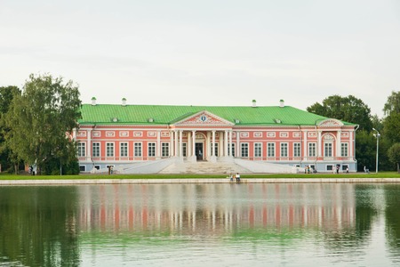 view of old manor house from the shore of pondのeditorial素材