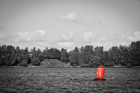 buoy on a lake on a summer day black and whiteの写真素材
