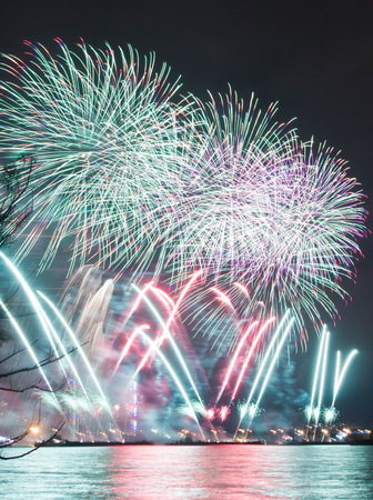 colorful salute on a holiday over the lakeの写真素材