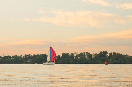 yacht on the lake in the summer eveningのeditorial素材