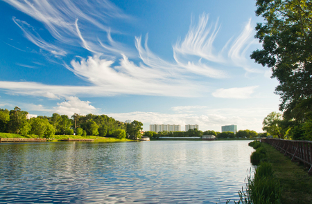 beautiful clouds over the lake on a summer dayの写真素材