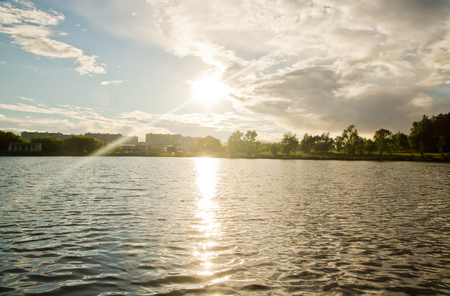 Sun over the water on a summer dayの写真素材