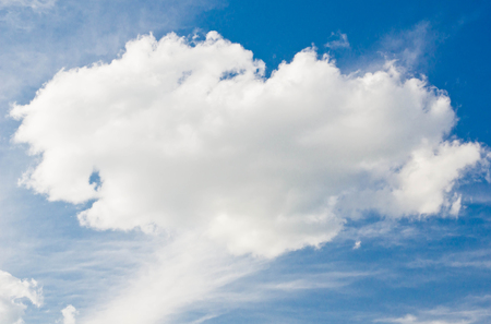cloud in the form of a heart in a blue skyの写真素材