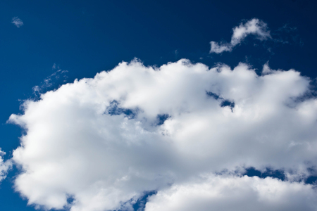 bright clouds in the dark blue skyの写真素材