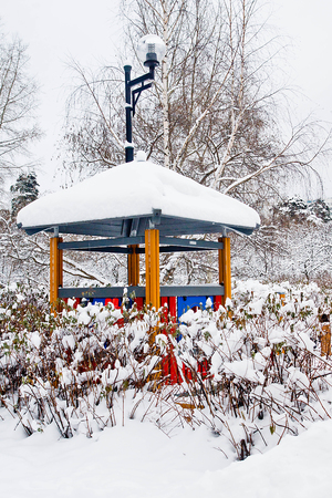 street lamp and garden house in winter parkの写真素材