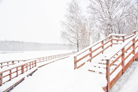 stairs under snow in a park in winterの写真素材