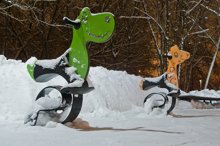 playground in the city park in the winter nightの写真素材