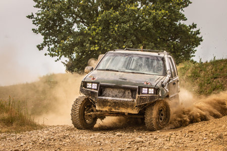 Truck racing on dirty road.