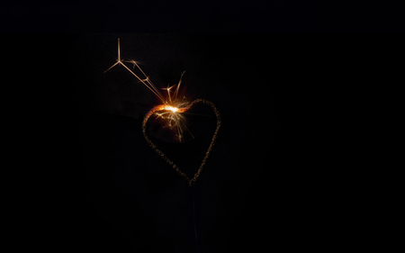 heart sparklers for celebration christmas and happy new year party background,の写真素材