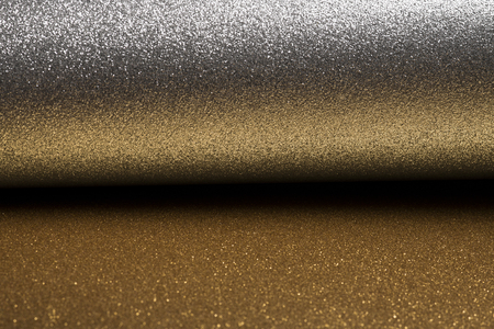 Detailed texture of glittering silver and gold dust surface for christmasの写真素材