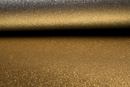 Detailed texture of glittering silver and gold dust surface for christmasの写真素材
