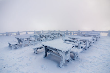 Snowy bench in winter at Czech highlands