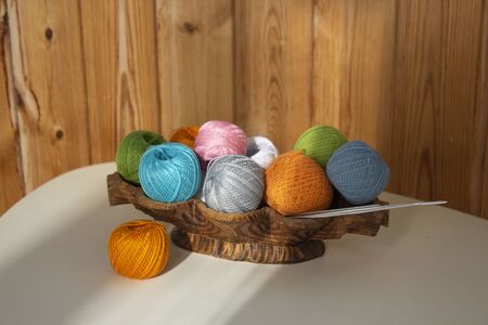 Colorful balls of thread with needles for knittingの写真素材