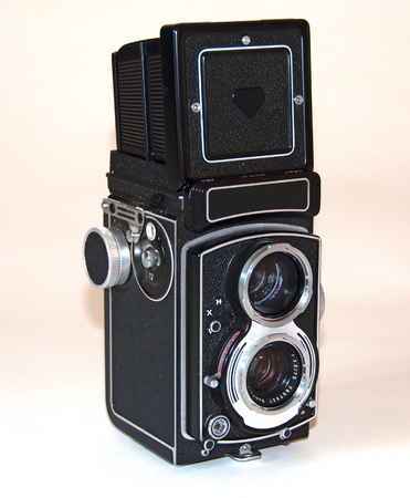A photo of a German-made vintage camer on a white background with the viewfinder extendedの写真素材