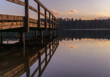 Wooden jetty or pier on lakeの写真素材