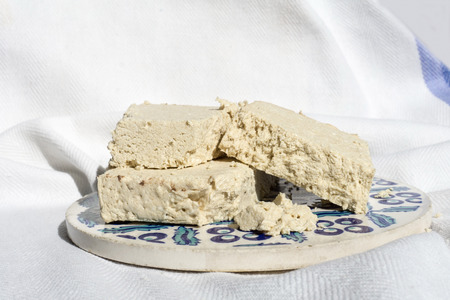Pieces of halva on the traditional ceramic plateの写真素材