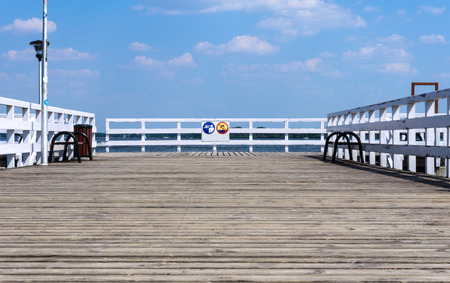 Wooden pier or jetty on lake, selective focus -  blurred foregroundの写真素材