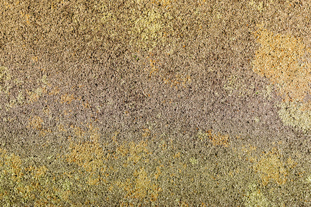 Colorful surface as background - brown, yellow stains and drops. Safety rubber floor mats. Children playgrounds and outdoor recreationsの写真素材