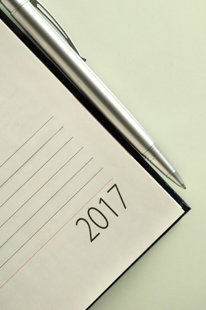 New Year 2017 office organizer calendar and sliver ballpen. Selective focusの写真素材