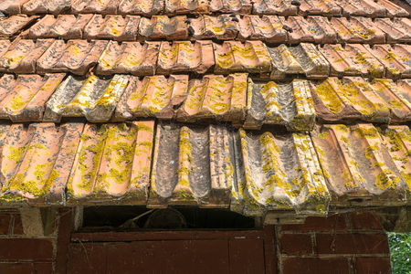 Ceramic tiles on roof of old hutの写真素材
