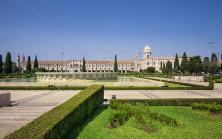 LISBON, PORTUGAL - August 30, 2018: Empire Square with the fountain and the Jeronimos Monastery on the background.のeditorial素材