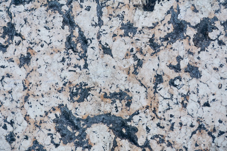 Detailed beige stone surface, texture of old natural spotted marbleの写真素材