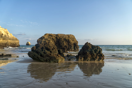 Rock formations on a Praia da Rocha in Portimao, Algarve region, Portugal. Late afternoon of sunny summer day.の写真素材
