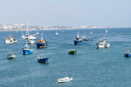 CASCAIS, PORTUGAL - September 2, 2018: Fishing boats floating in the fish port of Cascais.のeditorial素材
