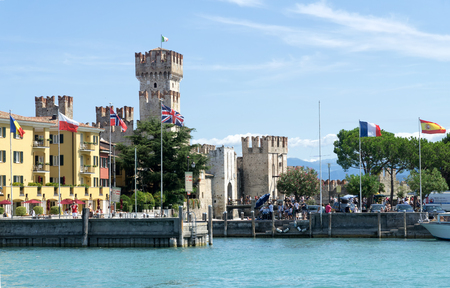 Sirmione, Italy -  August 07 2017: View of Sirmione harbor and Scaligero Castle from Garda Lake. Sirmione is medieval town located on the Sirmio peninsula of Lake Garda, Italy, Europe.のeditorial素材