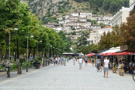 BERAT, ALBANIA, September 09, 2019: View of the old town called Mangalem and the castle hill from Boulevard Republika, which is the most important meeting place for the inhabitants of Beratu. Berat is on the UNESCO World Heritage Site.のeditorial素材