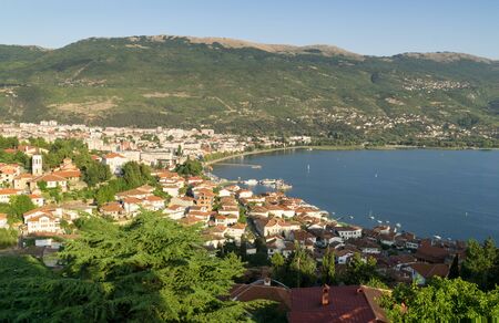 Ohrid and Ohrid Lake on a sunny summer day, view from above from the castle hill, in the background the mountains and the blue sky. Ohrid and Lake Ohrid are Culturalの写真素材
