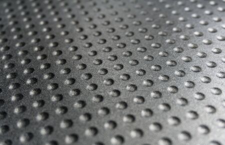 Metallic background with dot pattern. Selective focus. Industrial, abstract background.の写真素材