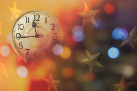 Retro style clock counting last moments before Christmass or New Year. Christmas and new years invitation colorful horizontal background.の写真素材