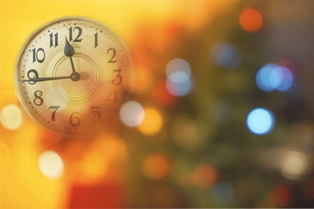 Retro style clock counting last moments before Christmass or New Year. Christmas and new years invitation colorful horizontal background.の写真素材