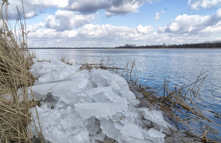 Floe near the river bank. The Narew River near Serock in Poland in early spring.の写真素材