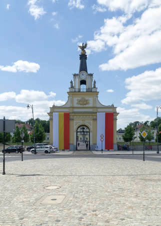 BIALYSTOK, POLAND - June 03, 2021: Gate of the Griffin of the Branicki Palace, the main gate decorated with flags of Poland and BiaÅystok, Poland, Europe.のeditorial素材
