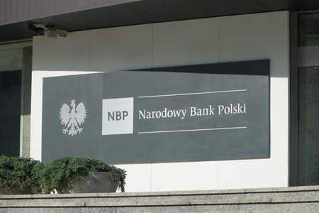 Warsaw, Poland - June 11, 2021: Logo and sign of Narodowy Bank Polski (National Bank of Poland, NBP). Signboard at the entrance to the NBP Head Office in Warsaw.のeditorial素材