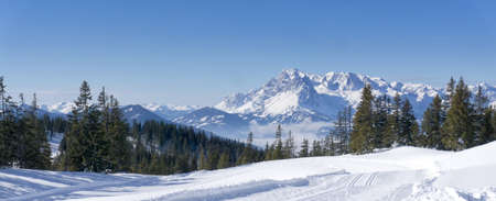 Wide scenic mountain panorama during wintertime in Salzburg Alps, Austria, Europe. View from Rossbrand mountain on valley and surrounding countryside.の写真素材