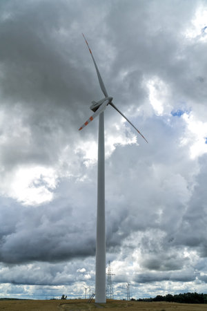 Wind turbine, windmill for electric power production sky with stormy clouds in the background - closeup. Renewable energy concept.の写真素材