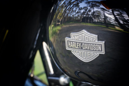 BRODNICA, POLAND, MAY 01, 2023: Emblem of Harley Davidson on fuel tank. Legendary Motorcycle black Harley Davidson.のeditorial素材